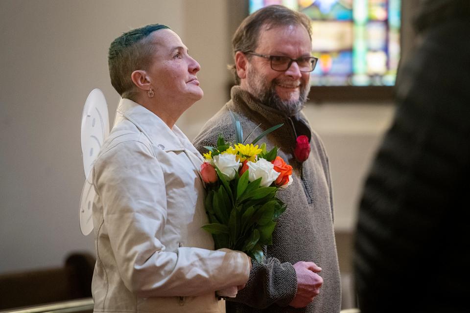 Christie Glenn looks to the ceiling in an attempt to hold in tears as she is walked down the aisle by Frank Yaun during her wedding ceremony at Trinity United Methodist Church, January 21, 2024. “It’s always been Christie and Jeffery ever since I’ve known them,” said Yaun.