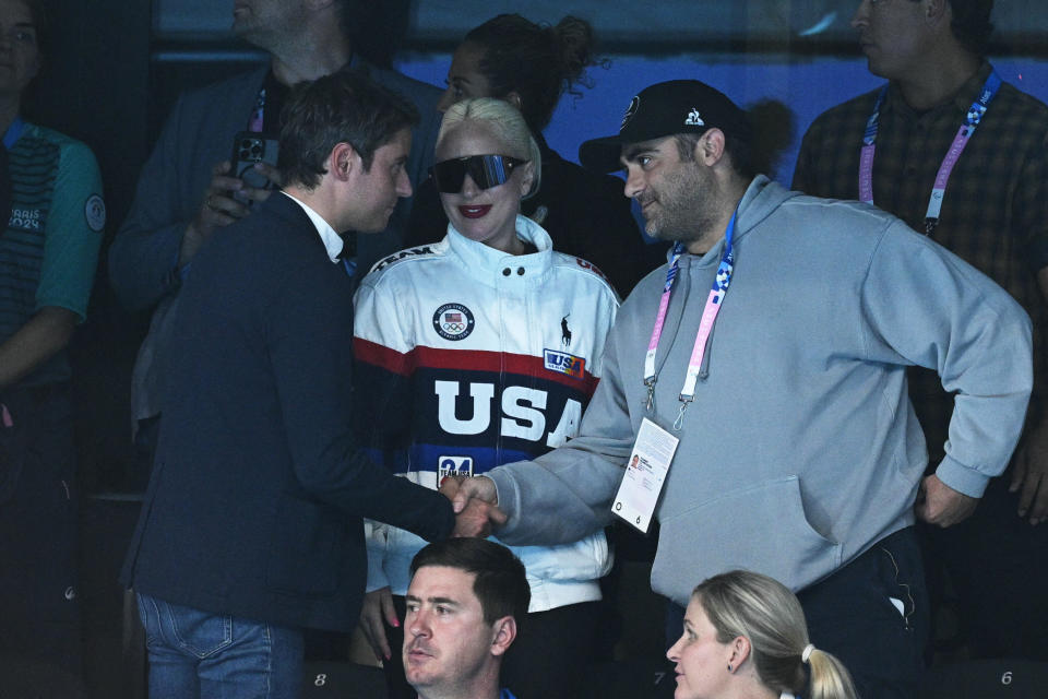 American singer and actress Lady Gaga (centre) and French Prime Minister Gabriel Attal (left) attend the swimming events during the Paris 2024 Olympic Games at the Paris La Defense Arena in Nanterre, west of Paris, on July 28, 2024. (Oli Scarfe/AFP) (Oli Scarfe/AFP via Getty Images)