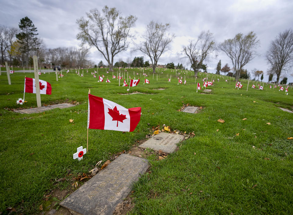 <p>Graves of veterans are honoured at the Dartmouth Memorial Gardens in Dartmouth, N.S. on Thursday, Nov. 10, 2022. Every year the Royal Canadian Legion Centennial Branch 160, assisted by youth organizations and community members, places a flag and poppy on the grave of each veteran in the cemetery. THE CANADIAN PRESS/Andrew Vaughan</p> 