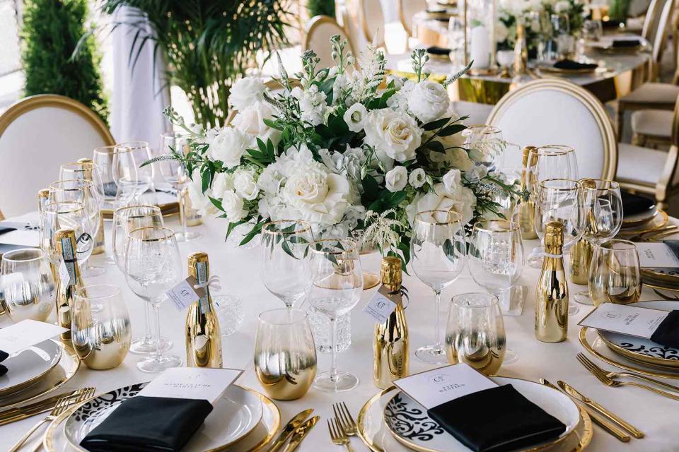 <p>Stephanie Nantel/Getty</p> A flower centerpiece at a wedding reception (stock image)