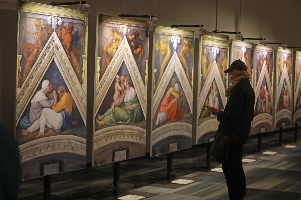 Multiple panels show portraits of Old Testament figures by Michelangelo at the Greater Columbus Convention Center.