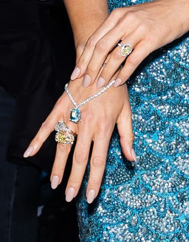 <p>Gotham/GC Images)</p> Bling queen! Blake Lively styled a diamond necklace as hand jewelry while fêting at Tiffany & Co's flagship store in New York City on May 2, 2024