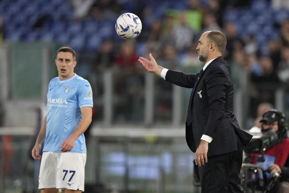 Lazio's head coach Igor Tudor holds the ball as he gives instructions during the Serie A soccer match between Lazio and Juventus at Rome's Olympic Stadium, Saturday, March 30, 2024. (AP Photo/Andrew Medichini)