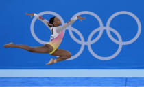 FILE - Rebeca Andrade, of Brazil, performs on the floor during the artistic gymnastics women's apparatus final at the 2020 Summer Olympics, Monday, Aug. 2, 2021, in Tokyo, Japan. (AP Photo/Gregory Bul, File)