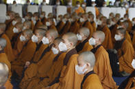 Buddhist monks attend the cremation of Vietnamese Buddhist monk Thich Nhat Hanh in Hue, Vietnam Saturday, Jan. 29, 2022. A funeral was held Saturday for Thich Nhat Hanh, a week after the renowned Zen master died at the age of 95 in Hue in central Vietnam. (AP Photo/Thanh Vo)