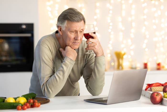 a man sitting in front of his laptop