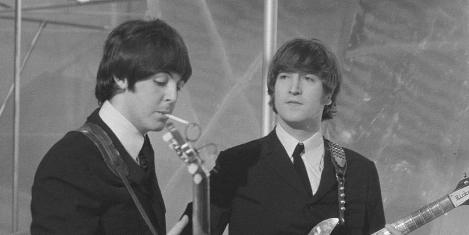 Musicians John Lennon (R) and Paul McCartney of English rock group The Beatles on the set of television special The Music of Lennon & McCartney at Granada Studios, Manchester, circa November 1965.