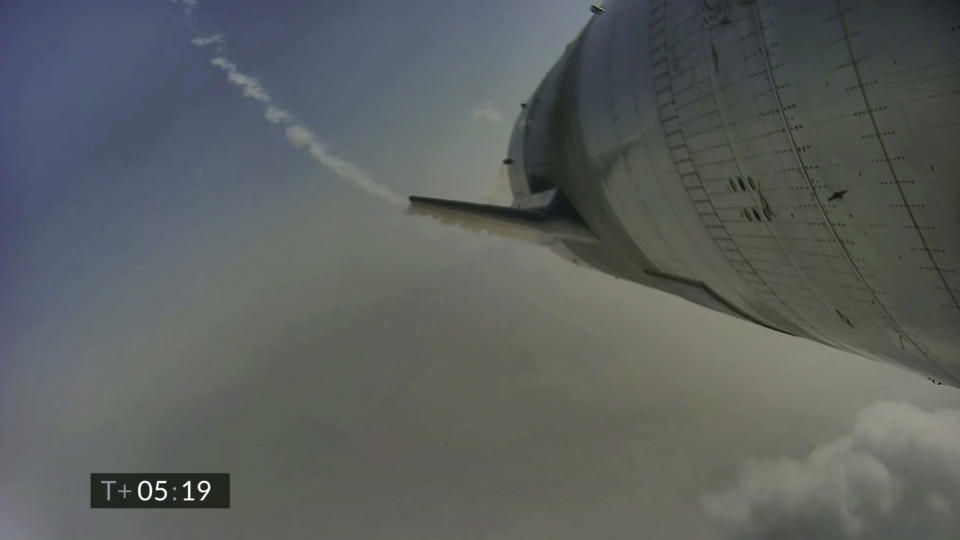 In this image from video made available by SpaceX, a Starship test vehicle descends during a flight test in Boca Chica, Texas on Wednesday, May 5, 2021. (SpaceX via AP)