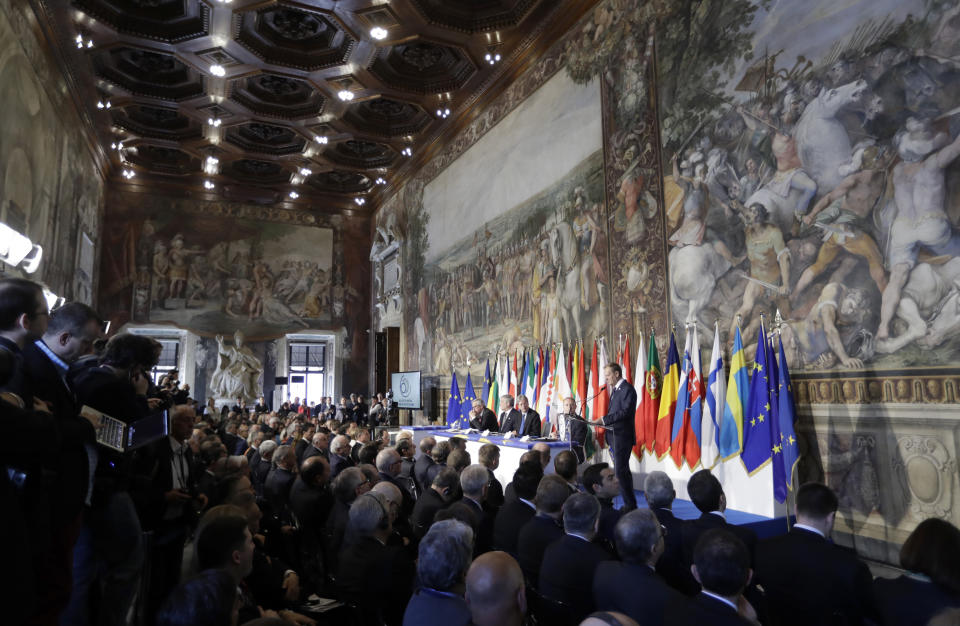 European Council President Donald Tusk, panel right, speaks to EU leaders during an EU summit meeting at the Orazi and Curiazi Hall in the Palazzo dei Conservatori in Rome on Saturday, March 25, 2017. European Union leaders were gathering in Rome to mark the 60th anniversary of their founding treaty and chart a way ahead following the decision of Britain to leave the 28-nation bloc. (AP Photo/Alessandra Tarantino)