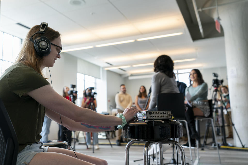 An NPR audio engineer checks microphones during an interview following a taping for NPR's Tiny Desk concert series featuring Becky G on Wednesday, Aug. 30, 2023, in Washington. (AP Photo/Stephanie Scarbrough)