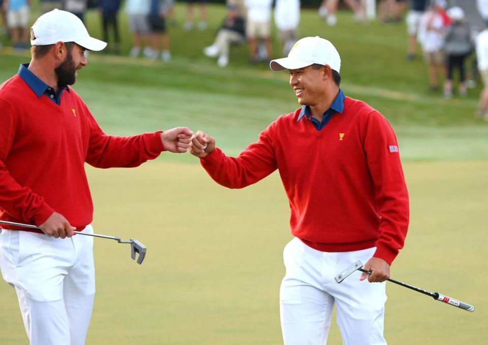 United States team members Cameron Young, left and Collin Morikawa, right, bump fists following Morikawa’s putt on the first green during third round action in the Presidents Cup at Quail Hollow in Charlotte, NC on Saturday, September 24, 2022.