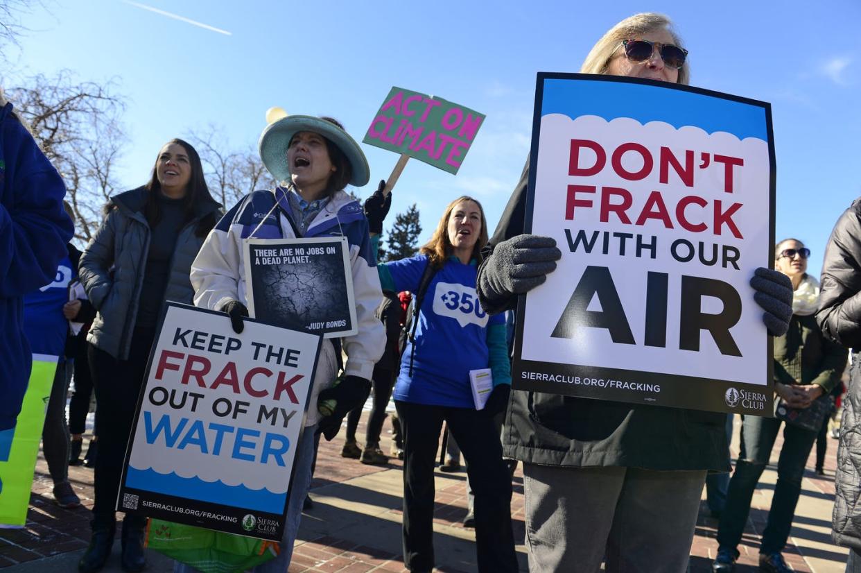 <span class="caption">Protesters rally to have Colorado's then-incoming governor put an up-to-nine-month moratorium on oil and gas development.</span> <span class="attribution"><a class="link " href="https://www.gettyimages.com/detail/news-photo/from-left-to-right-sandy-tolland-in-hat-miranda-glasbergen-news-photo/1076896552?adppopup=true" rel="nofollow noopener" target="_blank" data-ylk="slk:Helen H. Richardson/The Denver Post via Getty Images;elm:context_link;itc:0;sec:content-canvas">Helen H. Richardson/The Denver Post via Getty Images</a></span>