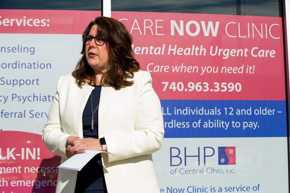 Dr. Kate St. James, President and CEO of Behavioral Healthcare Partners of Central Ohio, speaks to a crowd that came out for the grand opening of the Care Now Clinic on Nov, 4, 2021, in downtown Newark.