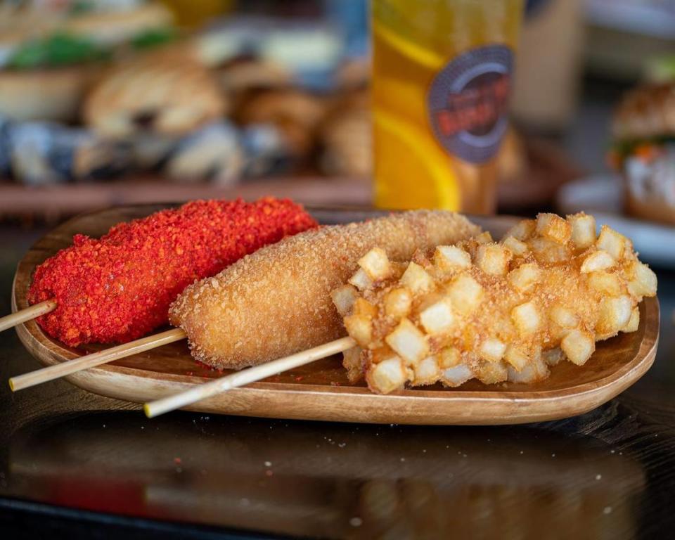 Korean corn dogs take the traditional corn dog concept, tweak it with seemingly random culinary craziness and top it with sugar.