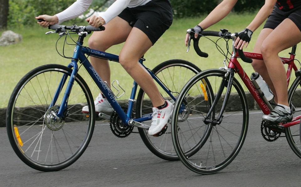 People riding bikes.