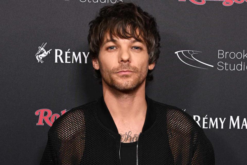 <p>Jeff Spicer/Getty</p> Louis Tomlinson