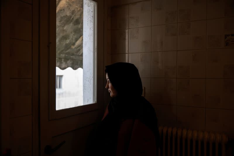 Afghan lawyer Bibi Chaman Hafizi poses for a picture in her apartment in Athens