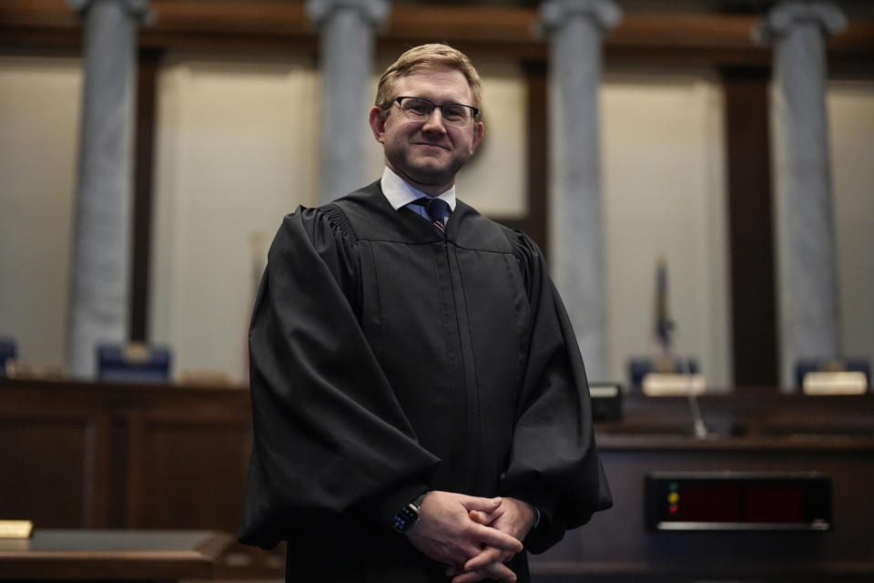 Supreme Court Justice Andrew Pinson poses for a photo, Wednesday, April 17, 2024, in Atlanta. Ga. Pinson, is running against John Barrow in a nonpartisan election for Supreme Court Justice, in May. (AP Photo/Mike Stewart)