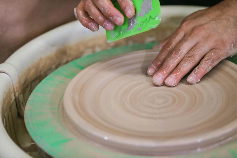 Hector Cobos Leon makes pottery dishes in his studio in Paseo Pottery in Oklahoma City on Thursday, May 19, 2022.