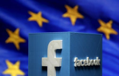 A 3D-printed Facebook logo is seen in front of the logo of the European Union in this picture illustration made in Zenica, Bosnia and Herzegovina on May 15, 2015.  REUTERS/Dado Ruvic