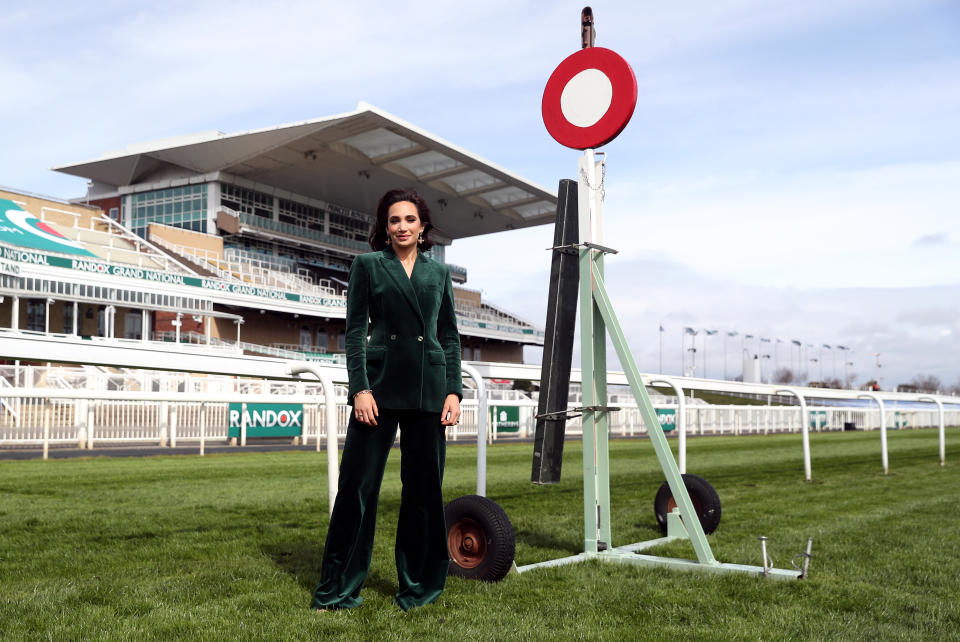 <p>Soprano singer Laura Wright poses next to the finishing post during Liverpool NHS Day of the 2021 Randox Health Grand National Festival at Aintree Racecourse, Liverpool. Picture date: Thursday April 8, 2021.</p>
