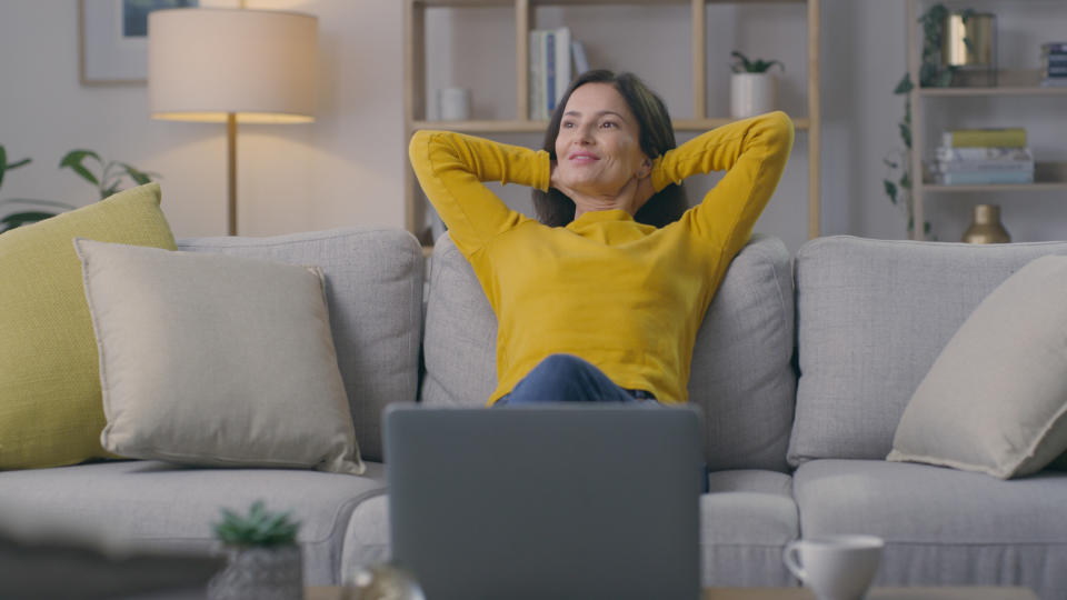 person relaxing on a couch alone