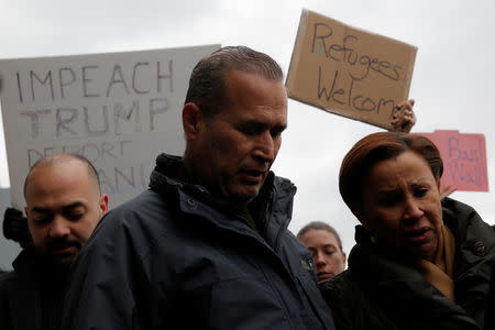 Iraqi immigrant Hameed Darwish stands with Congresswoman Nydia Velazquez (R) after being released at John F. Kennedy International Airport in Queens, New York. REUTERS/Andrew Kelly