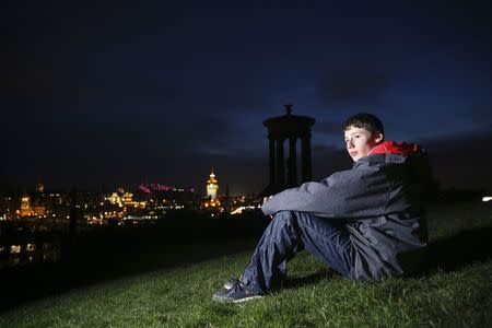 School student Jack Capener, 16, poses for a photograph on Calton Hill in Edinburgh March 4, 2014. REUTERS/Paul Hackett