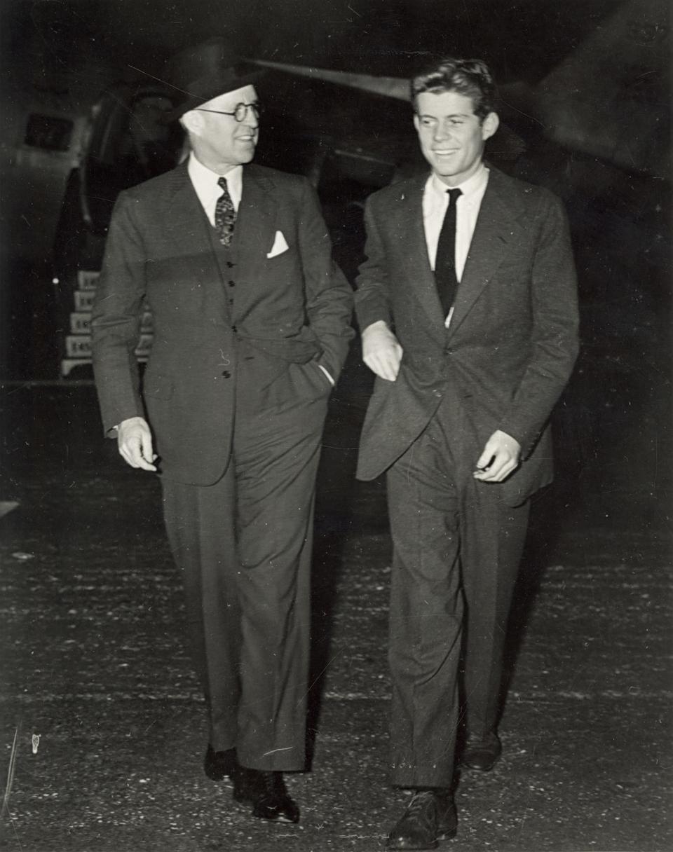 JFK, right, arriving in Palm Beach with his father, Joe.