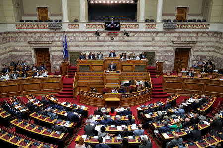 Greek Prime Minister Alexis Tsipras addresses lawmakers during a parliamentary session before a vote on tax breaks in Athens, Greece, May 15, 2019. REUTERS/Alkis Konstantinidis
