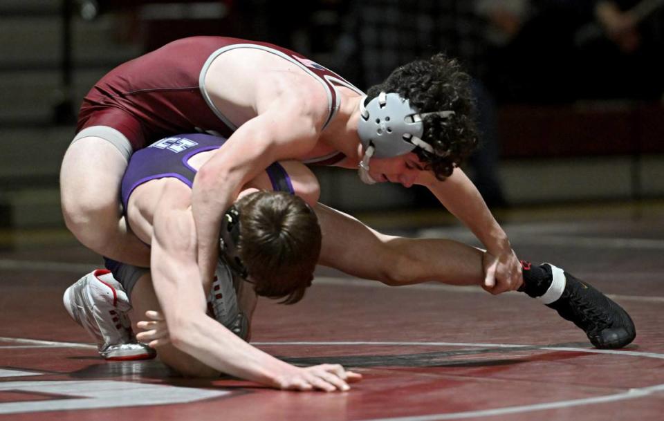 State College’s Jon Whitbred wrestles Mifflin County’s Paxton Shawver in the 114 lb bout of the match on Thursday, Jan. 25, 2024.