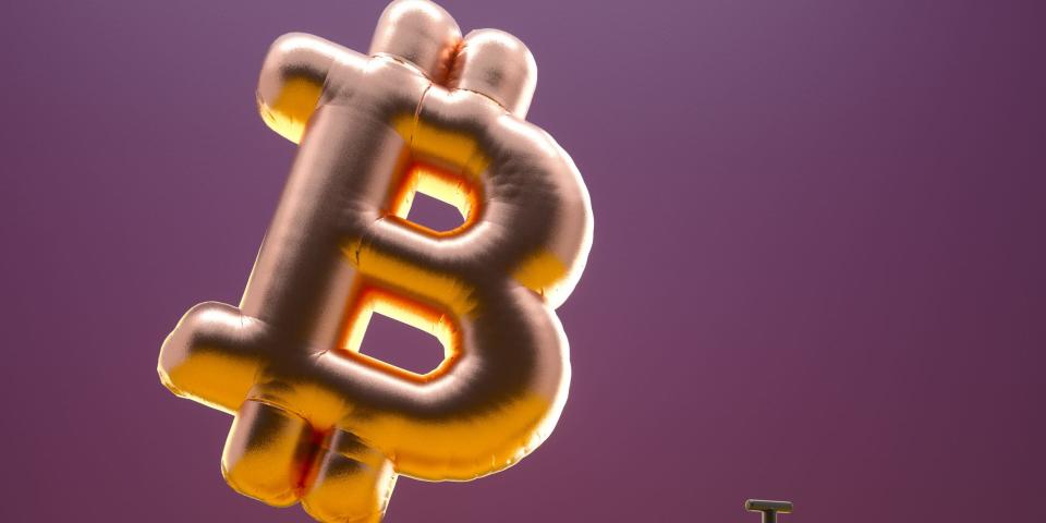 Bitcoin sign balloon inflating