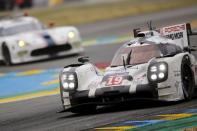 Nick Tandy of Britain drives his Porsche 919 Hybrid number 19 during the Le Mans 24 Hours sportscar race in Le Mans, central France June 14, 2015. The Porsche 919 Hybrid number 19 is also driven by Earl Bamber of New Zealand and Nico Huelkenberg of Germany. REUTERS/Stephane Mahe