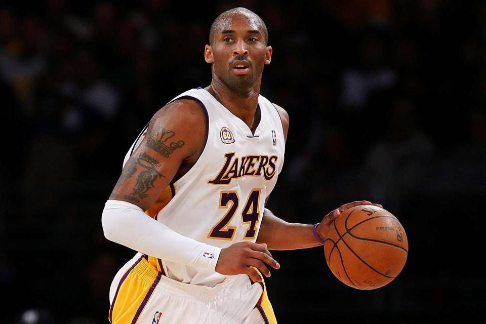 <p>Lisa Blumenfeld/Getty</p> Kobe Bryant #24 of the Los Angeles Lakers drives the ball upcourt during the game against the Cleveland Cavaliers at Staples Center on Jan. 27, 2008