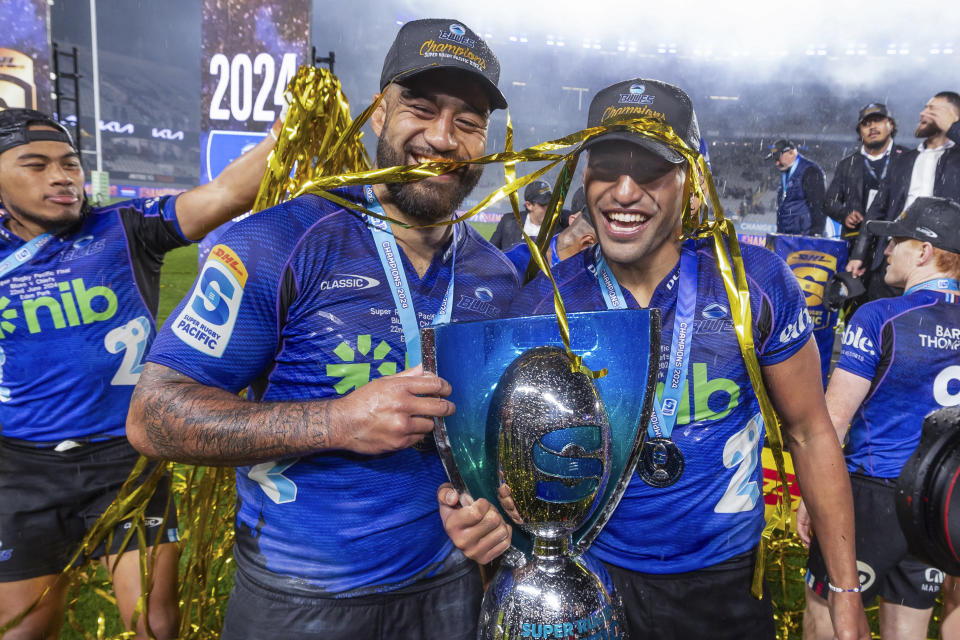 Blues players Akira, left, and Rieko Ioane celebrate their win in the Super Rugby final against the Chiefs in Auckland, New Zealand, Saturday, June 22, 2024. (Brett Phibbs/Photosport via AP)