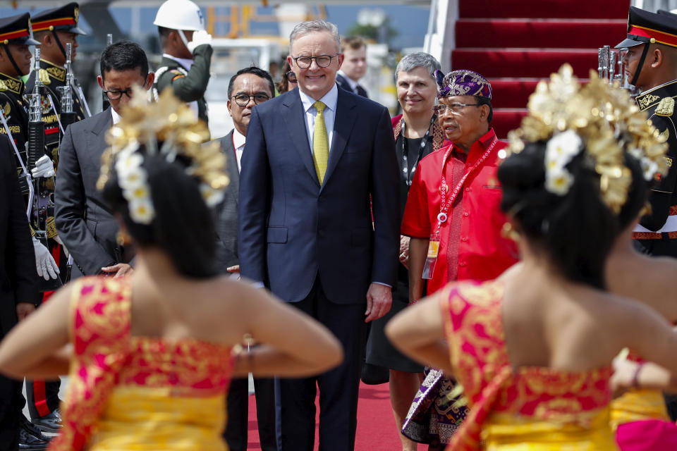 Australian Prime Minister Anthony Albanese, center, watches Balinese dancers perform upon arrival at Ngurah Rai International Airport ahead of the G20 Summit in Bali, Indonesia, Monday, Nov. 14, 2022. (Ajeng Dinar Ulfiana/Pool Photo via AP)