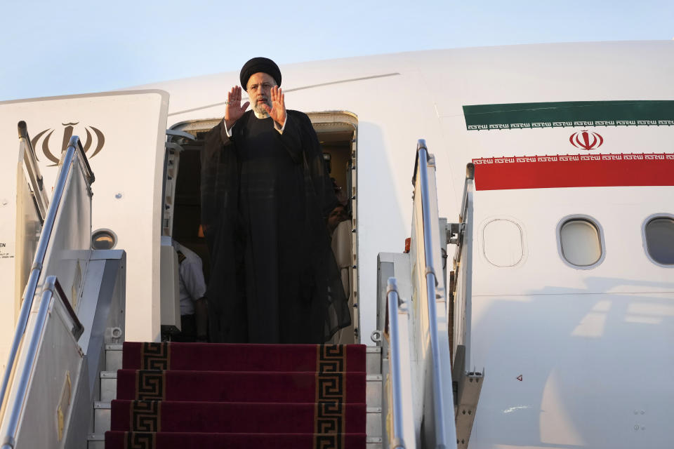 Iranian President Ebrahim Raisi waves to media and officials as he boards his plane while leaving Tehran's Mehrabad airport to New York to attend annual UN General Assembly meeting, Monday, Sept. 19, 2022. Raisi headed to New York on Monday, where he will be speaking to the U.N. General Assembly later this week, saying that he has no plans to meet with President Joe Biden on the sidelines of the U.N. event. (AP Photo/Vahid Salemi)