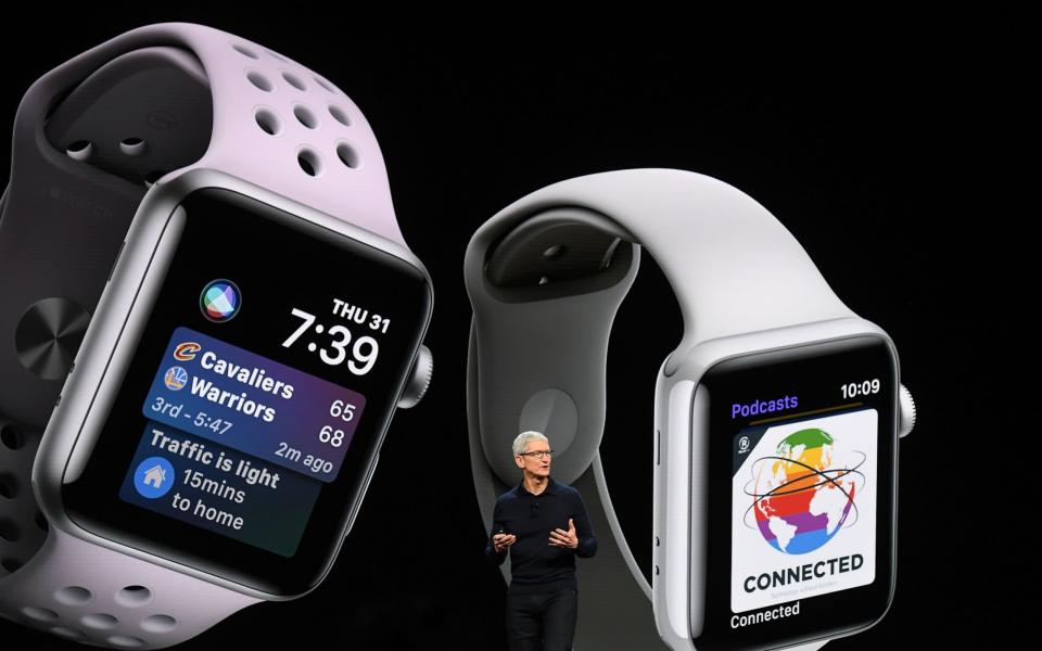 Tim Cook showing off the Apple Watch 3 - Bloomberg