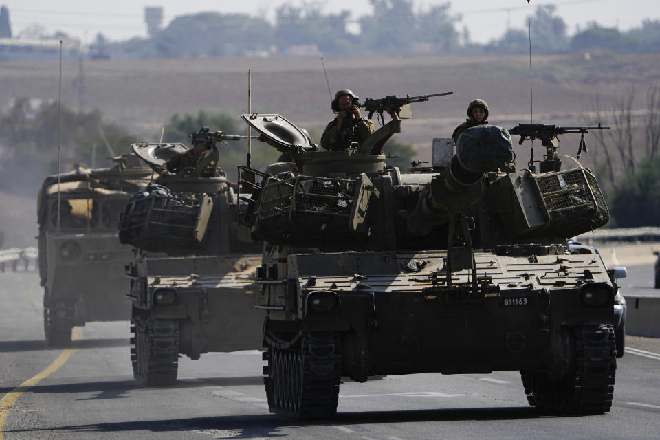 Israeli armored personnel carriers and tanks move towards the Gaza Strip border in southern Israel Wednesday, Nov.1, 2023. Israeli ground forces have been operating in Gaza in recent days as Israel presses ahead with its war against Hamas militants. (AP Photo/Ariel Schalit)