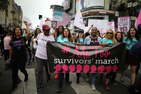 People participate in a protest march for survivors of sexual assault and their supporters in Hollywood, Los Angeles, California U.S. November 12, 2017. REUTERS/Lucy Nicholson