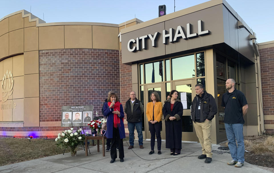 Burnsville, Minn. , Mayor Elizabeth Kautz speaks during a vigil outside Burnsville City Hall, Tuesday, Feb. 20, 2024, for Burnsville Police Officers Paul Elmstrand and Matthew Ruge and Firefighter/Paramedic Adam Finseth, who were killed in the line of duty on Feb. 18, 2024. From left to right are Burnsville City Council Member Dan Gustafson, U.S. Rep. Angie Craig, U.S. Sen. Amy Klobuchar and Minneapolis police chaplains David Engman and Scott Brekke. (Mara H. Gottfried/Pioneer Press via AP)