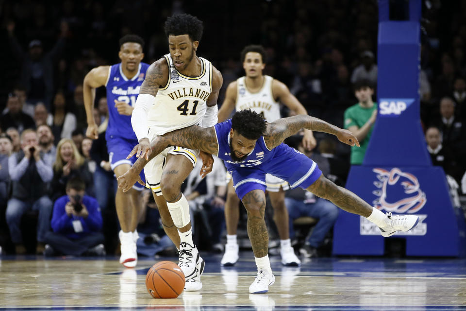 Villanova's Saddiq Bey, left, steals the ball from Seton Hall's Myles Powell during the first half of an NCAA college basketball game, Saturday, Feb. 8, 2020, in Philadelphia. (AP Photo/Matt Slocum)