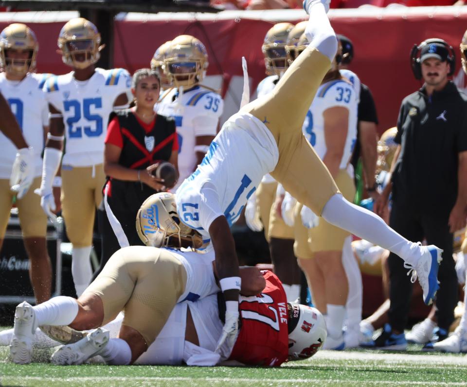 Utah Utes wide receiver Devaughn Vele (17) is tackled by UCLA Bruins defensive back Kamari Ramsey (27) in Salt Lake City on Saturday, Sept. 23, 2023. Utah won 14-7. | Jeffrey D. Allred, Deseret News