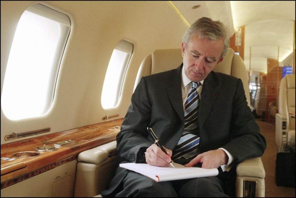 LVMH CEO Bernard Arnault on board his private jet between Beijing and Shanghai. in Shanghai, China on October 11, 2004.