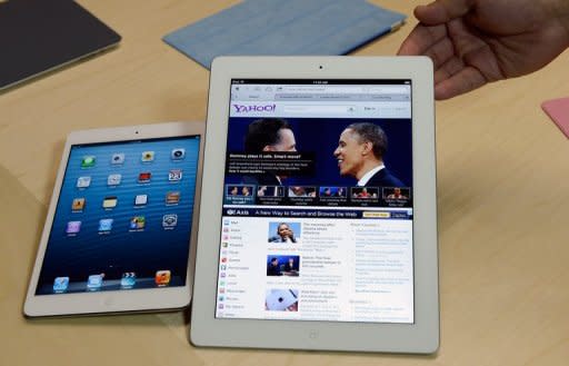 The new iPad mini (L) compared to the fourth generation iPad