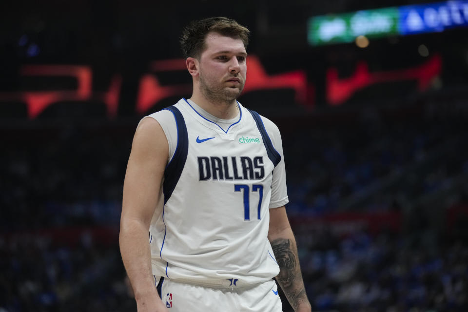 Dallas Mavericks guard Luka Doncic (77) reacts to a foul call during the first half of Game 1 of an NBA basketball first-round playoff series against the LA Clippers in Los Angeles, Sunday, April 21, 2024. (AP Photo/Ashley Landis)