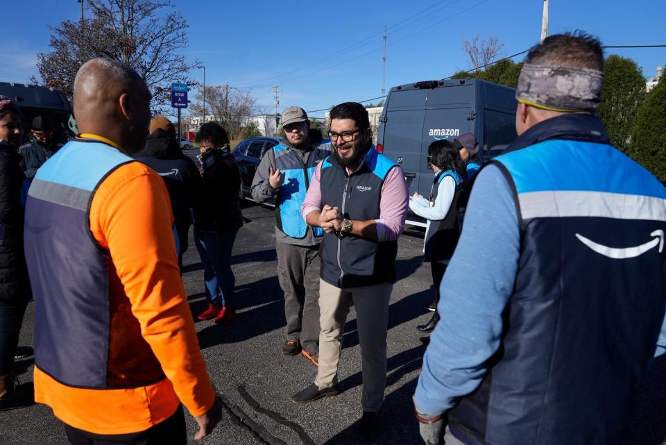 Dispatcher William Espinal speaks to the Amazon drivers during a morning meeting before they set out to make the day's deliveries.