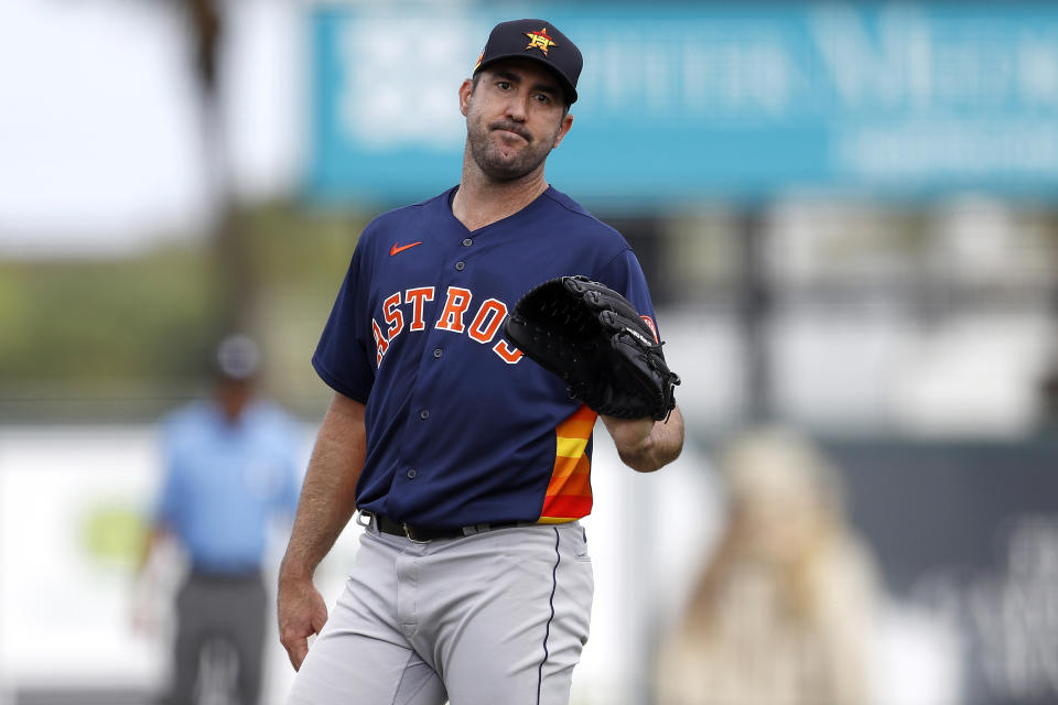 FILE - In this March 3, 2020, file photo, Houston Astros pitcher Justin Verlander reacts after a pitch during the third inning of a spring training baseball game against the St. Louis Cardinals in Jupiter, Fla. The Astros announced Saturday, Sept. 19, 2020, that Verlander needs Tommy John surgery and could miss the entire 2021 season. (AP Photo/Julio Cortez)