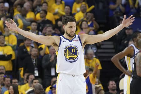 FILE PHOTO: April 28, 2019; Oakland, CA, USA; Golden State Warriors guard Klay Thompson (11) celebrates against the Houston Rockets during the fourth quarter in game one of the second round of the 2019 NBA Playoffs at Oracle Arena. The Warriors defeated the Rockets 104-100. Mandatory Credit: Kyle Terada-USA TODAY Sports
