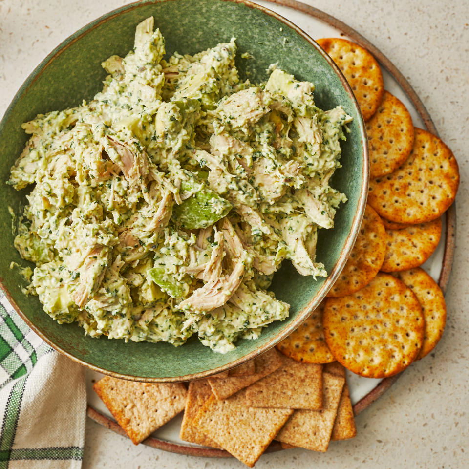 <p>This avocado chicken salad is herbaceous, bright and creamy. The blend of cilantro, dill and chives pairs nicely with fresh avocado. Enjoy this easy chicken salad over lettuce, on crackers or in a wrap. <a href="https://www.eatingwell.com/recipe/7964485/avocado-chicken-salad/" rel="nofollow noopener" target="_blank" data-ylk="slk:View Recipe" class="link ">View Recipe</a></p>